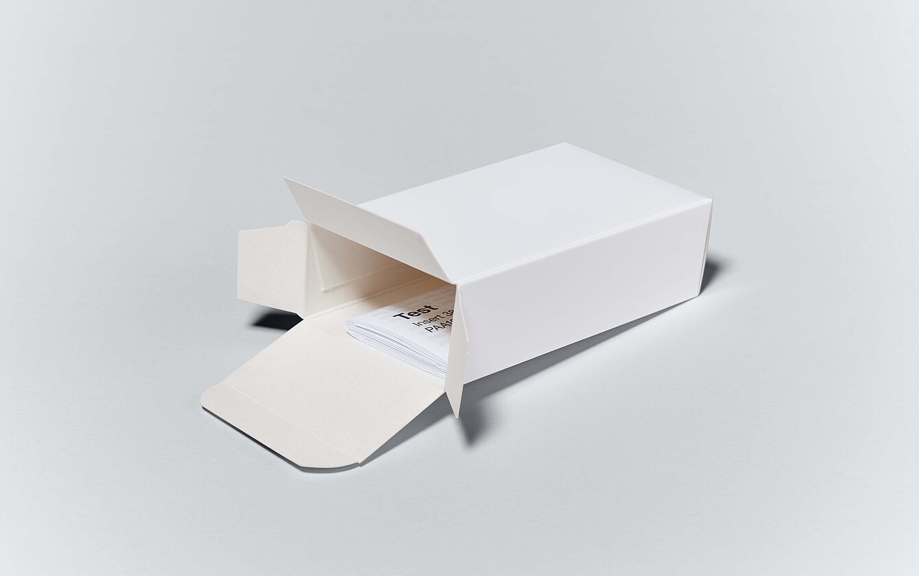 Folding carton from Faller Packaging with integrated package leaflet – space-saving and user-friendly pharmaceutical packaging solution.
