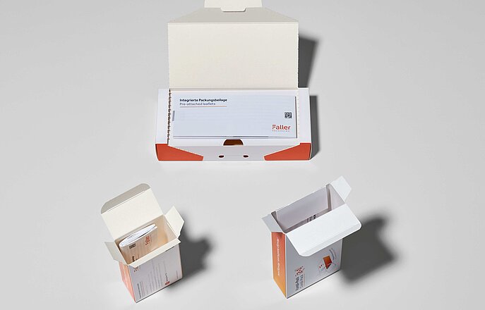 The combination of folding carton and leaflet